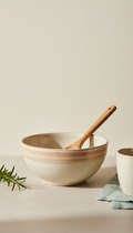 Ceramic mixing bowl with wooden spoon